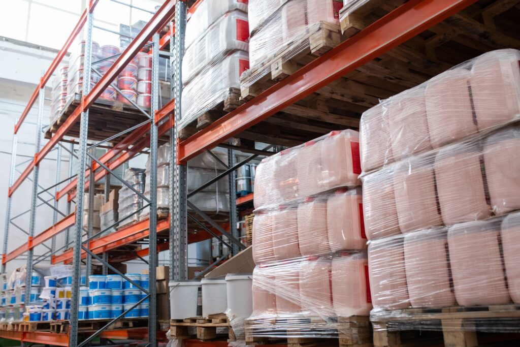 Stretch wrap bags around pallets in warehouse